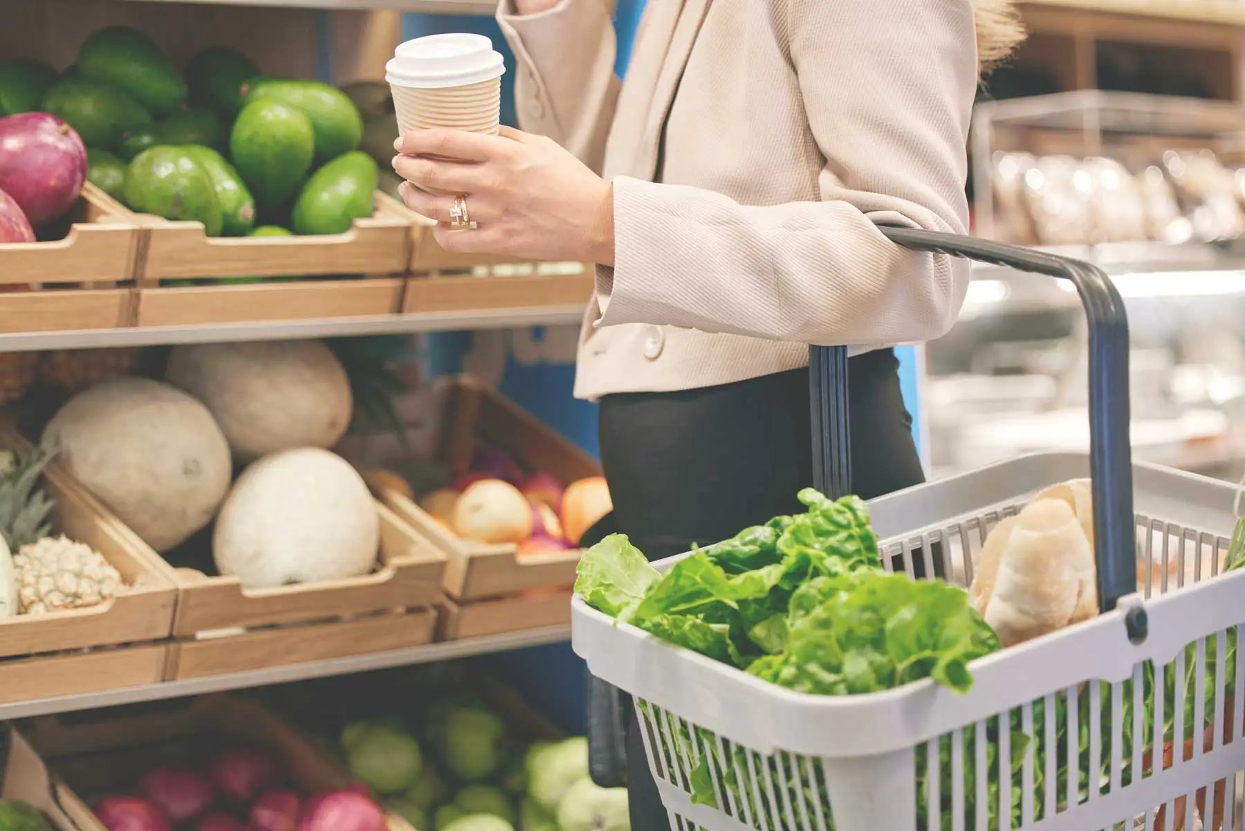 Picture of a woman getting groceries in a supermarket.